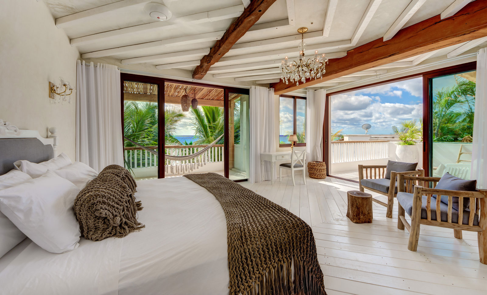 beachfront master bedroom in an amazing villa views